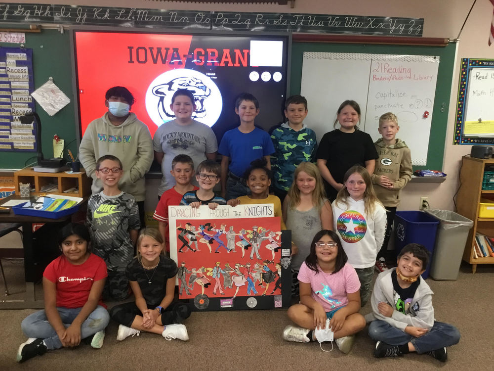 4-2 Class Picture with Our Homecoming Poster