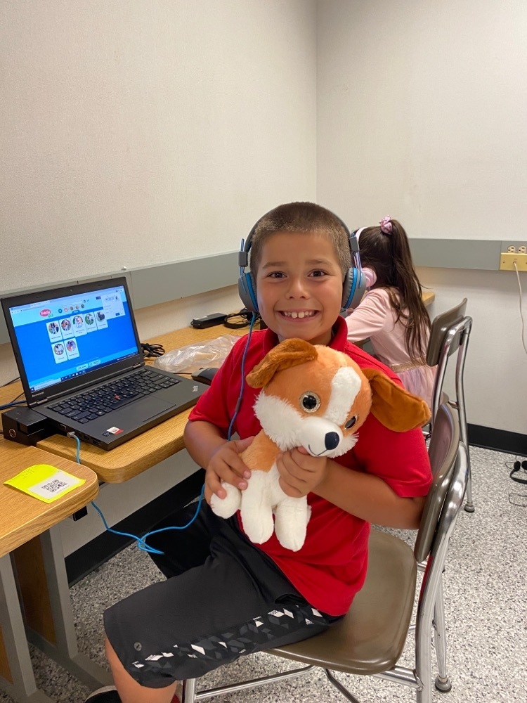 Student learning about pets on the computer.