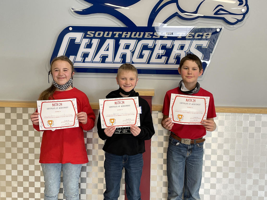 3 students holding their Math award certificates